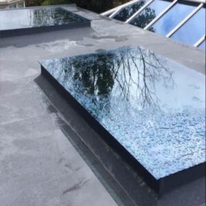 Flat roof installation and repair with skylight installed - Roofers Galway