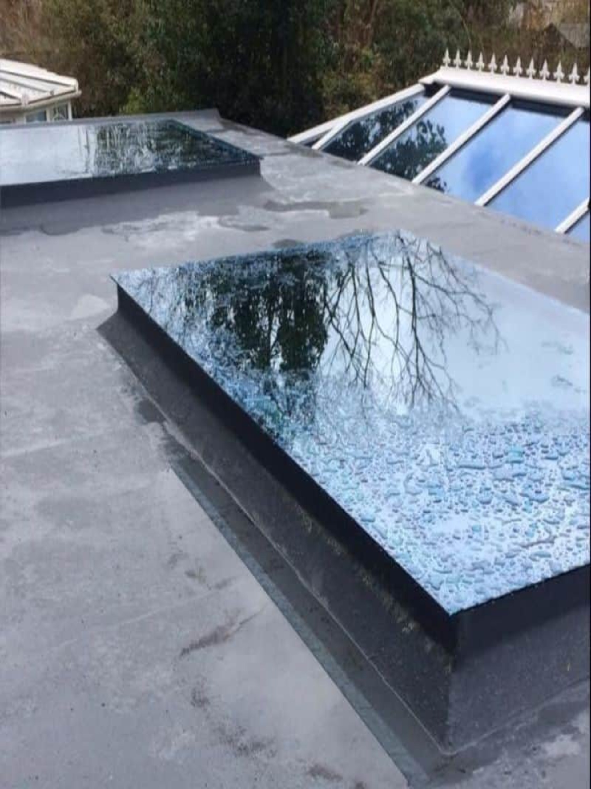Flat roof installation and repair with skylight installed - Roofers Galway